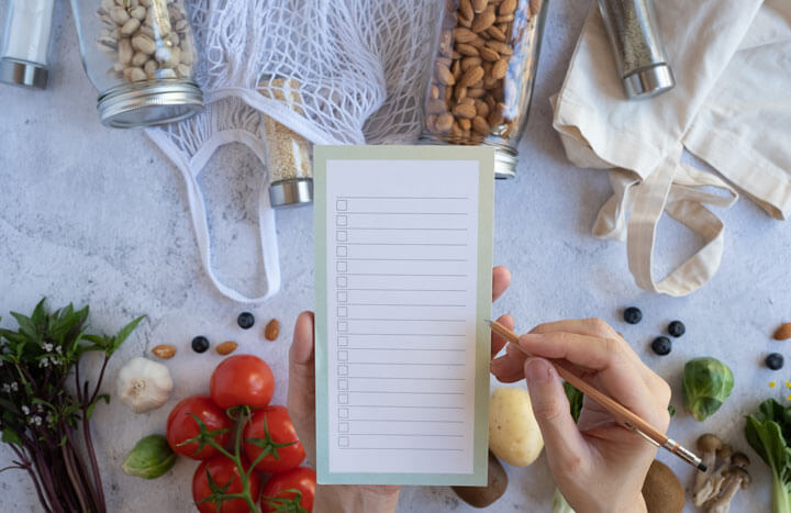 hand writing a shopping list hand writing a shopping list