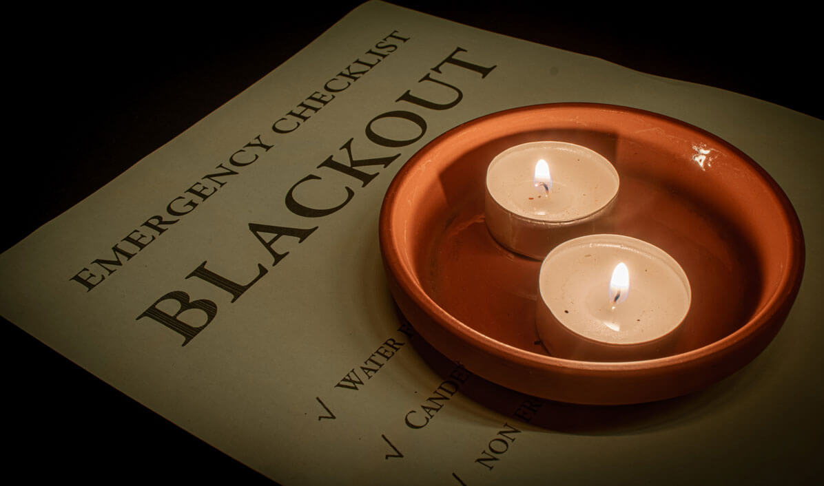 checklist with two lit tea candles checklist with two lit tea candles