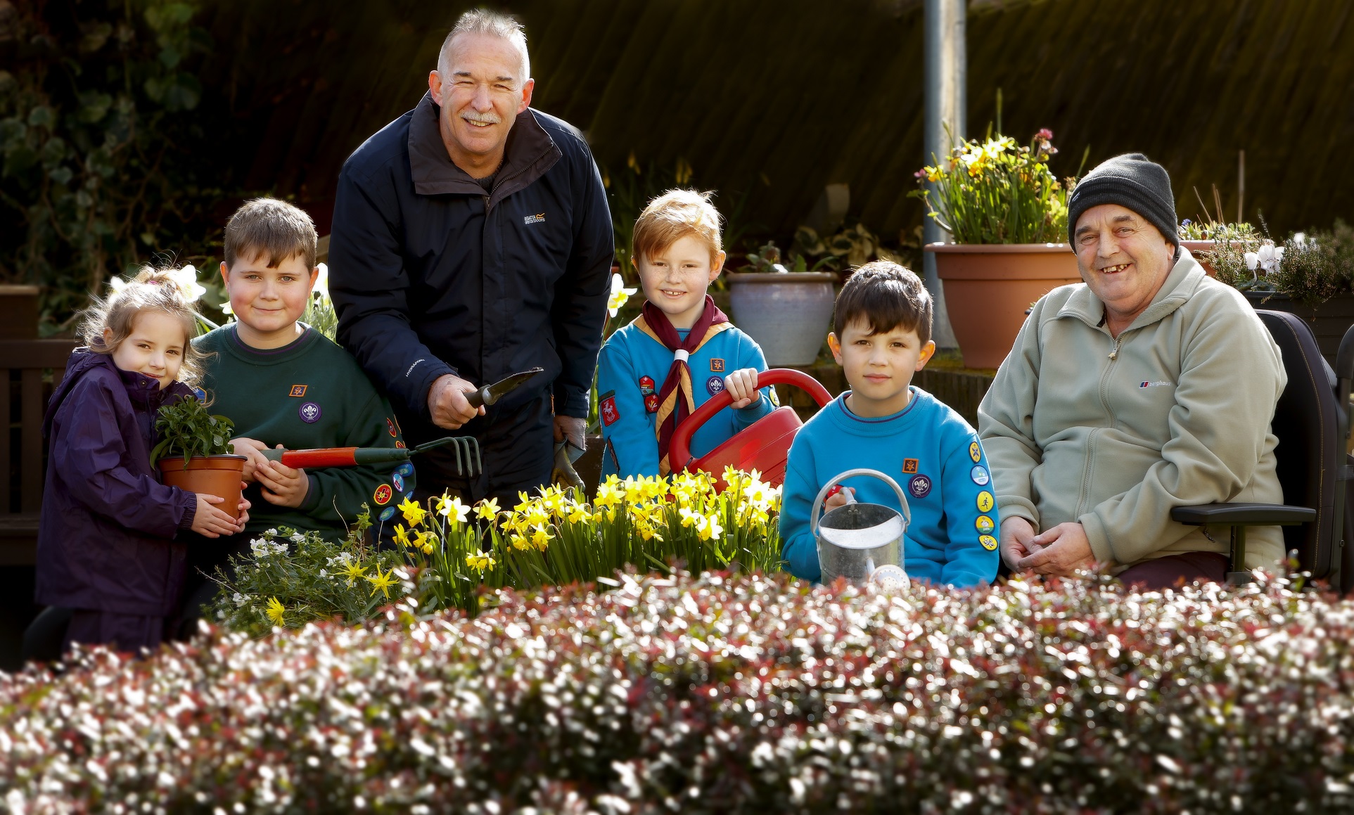 Members of the 5th Deal Scout group pictured with Caesar Court’s gardeners, Steve Baker and Tony Hennebury.