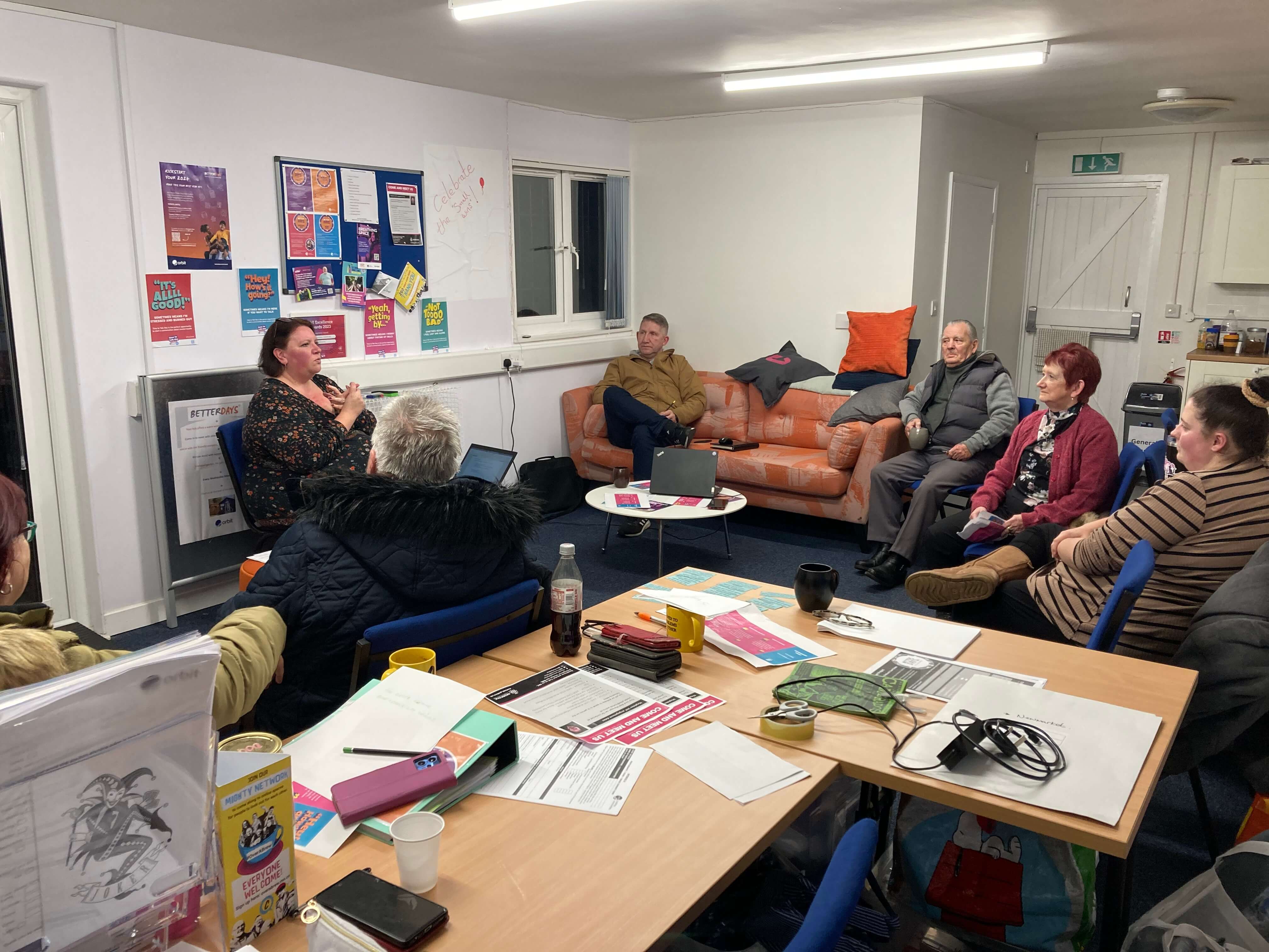 people sitting in a circle in a lounge talking people sitting in a circle in a lounge talking