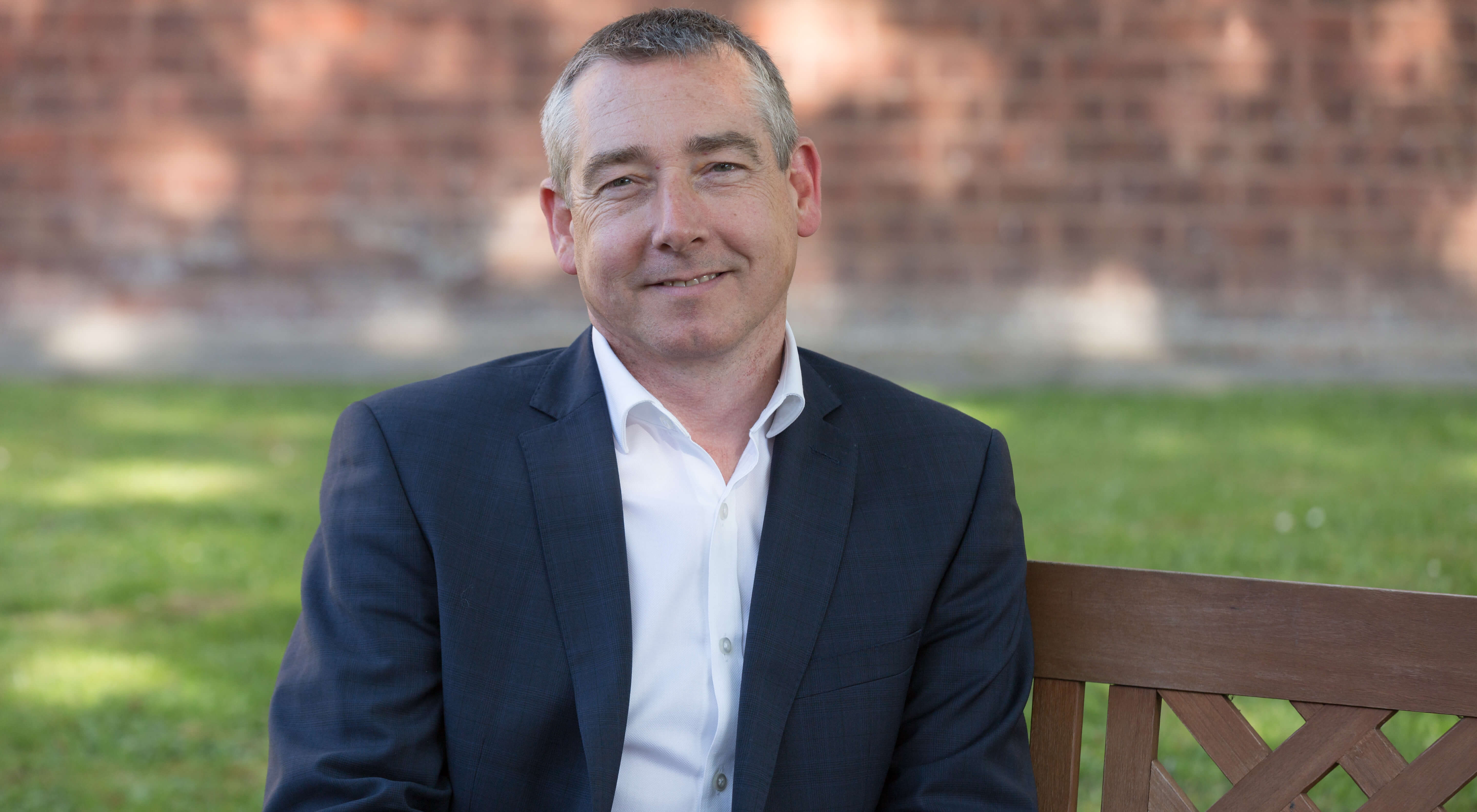 Phil Andrew sitting on a bench