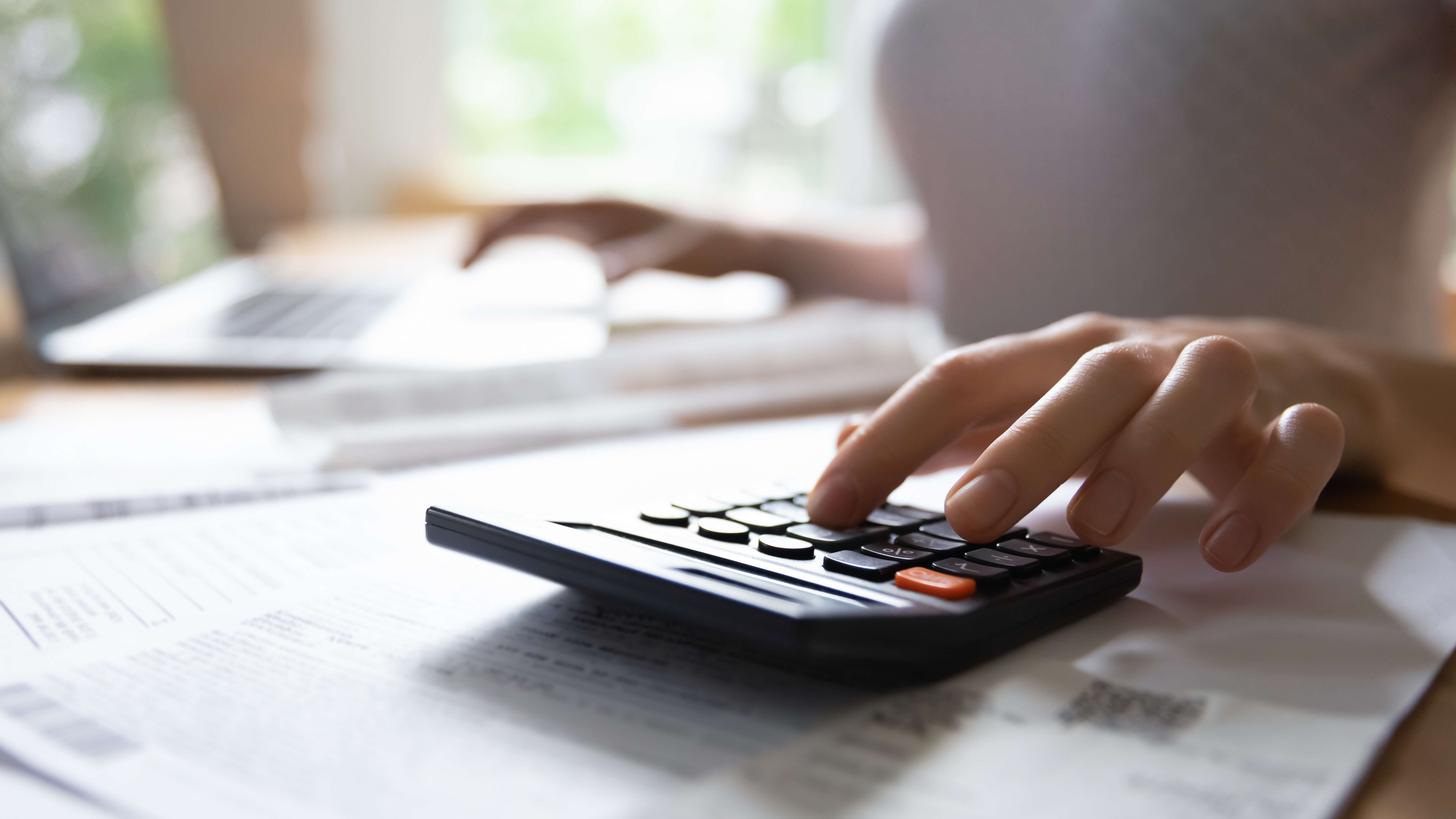a person using a calculator a person using a calculator