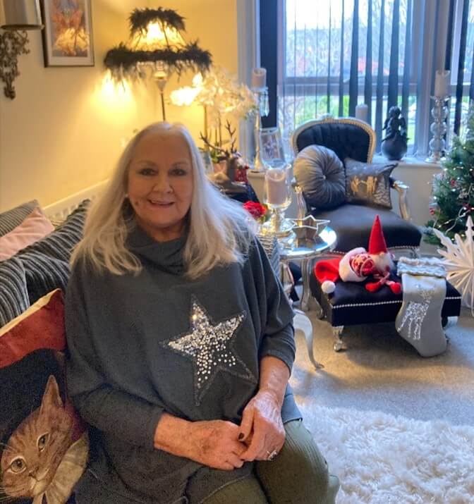Orbit customer Sandy sat with her christmas decorations