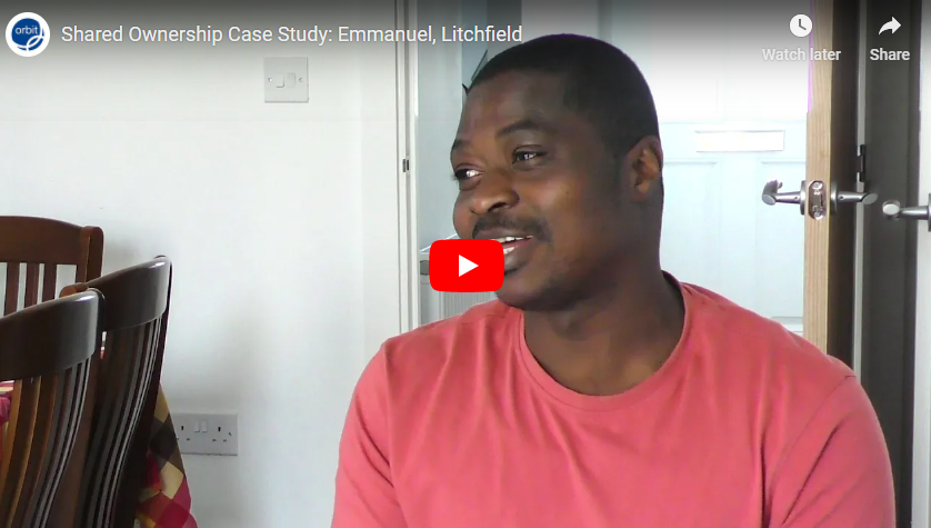 Man smiling wearing a peach shirt