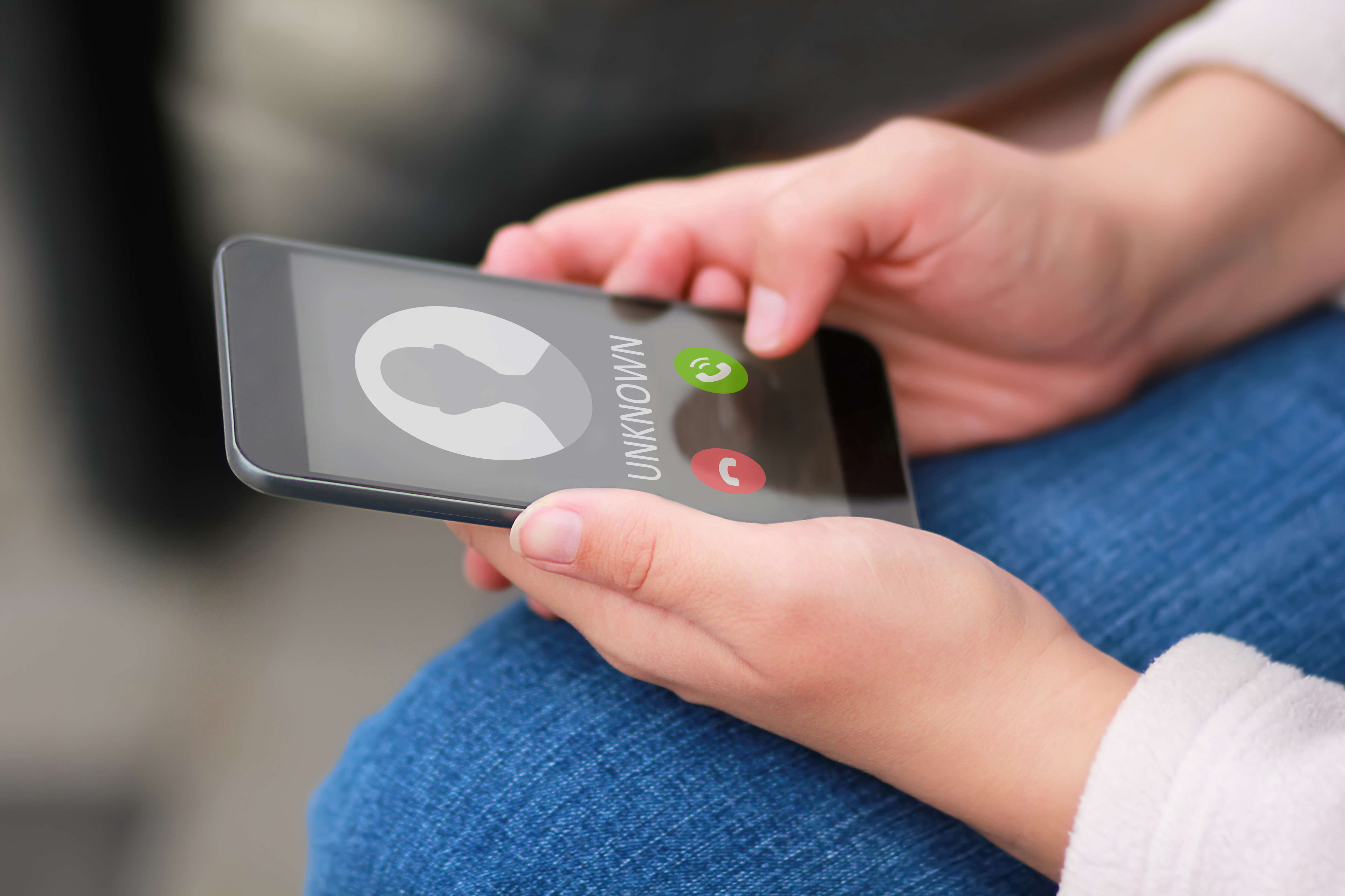 hands holding a mobile phone going to answer or decline a call hands holding a mobile phone going to answer or decline a call