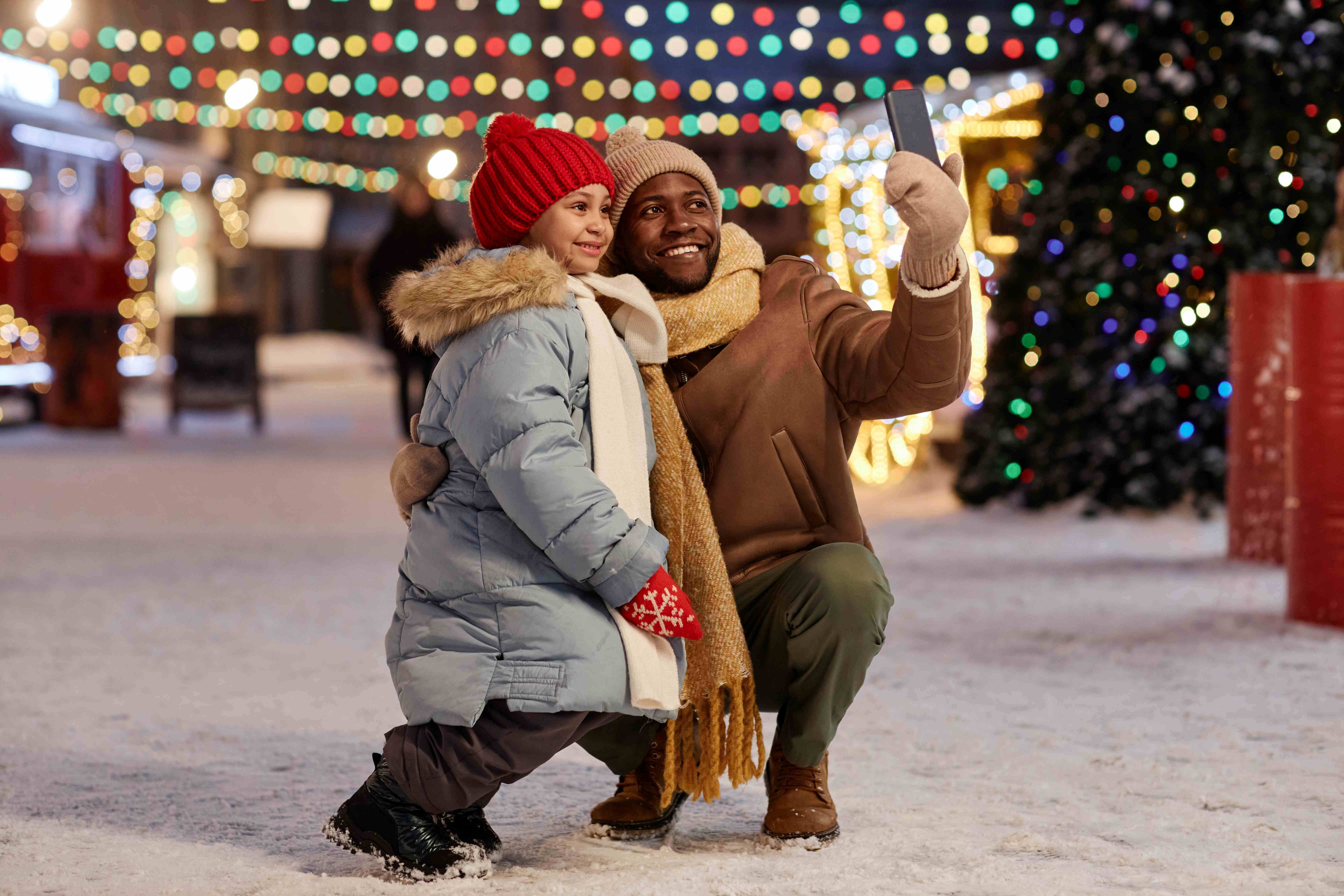 father taking a festive selfie with his daughter
