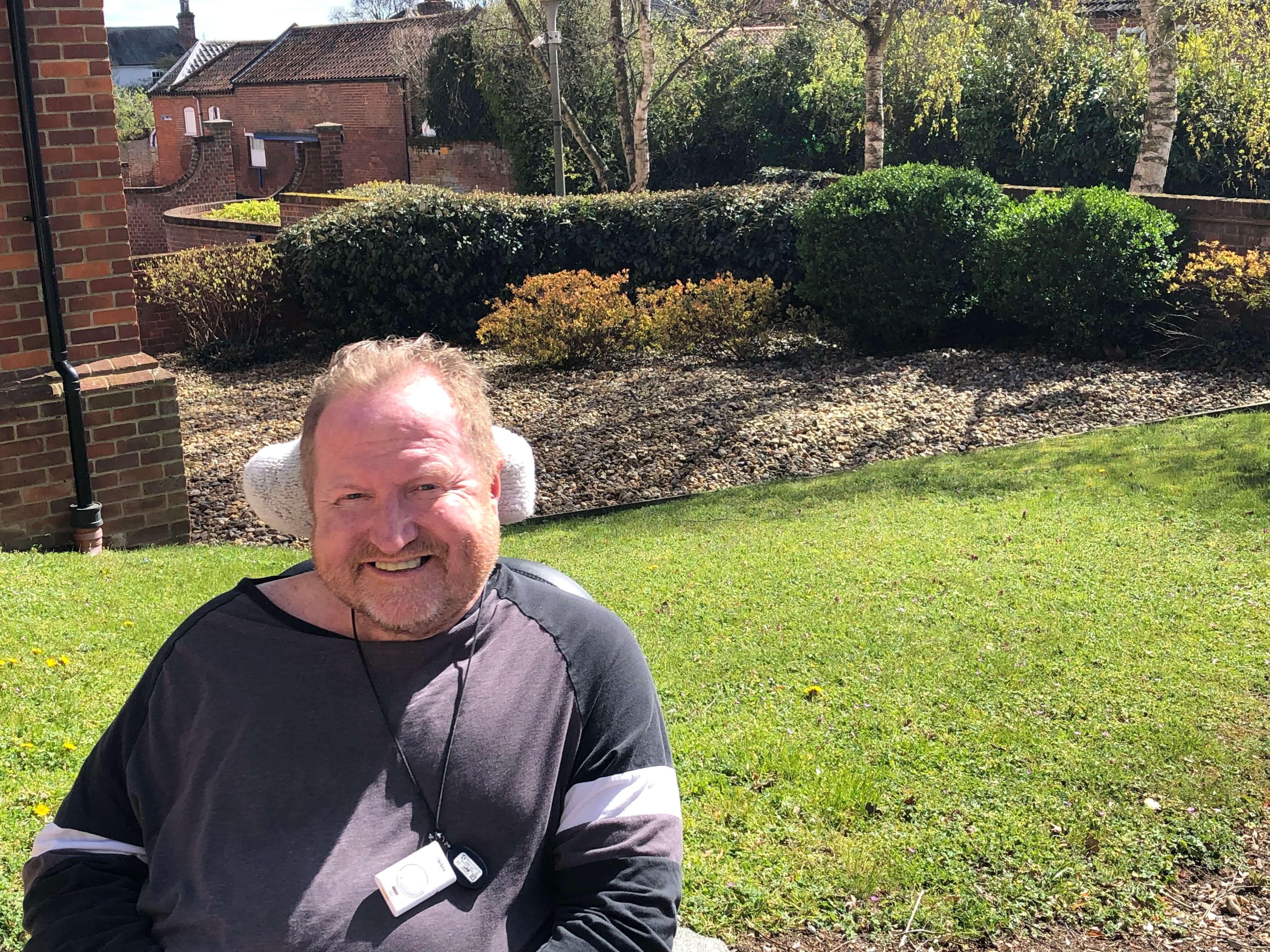 man sitting in a garden