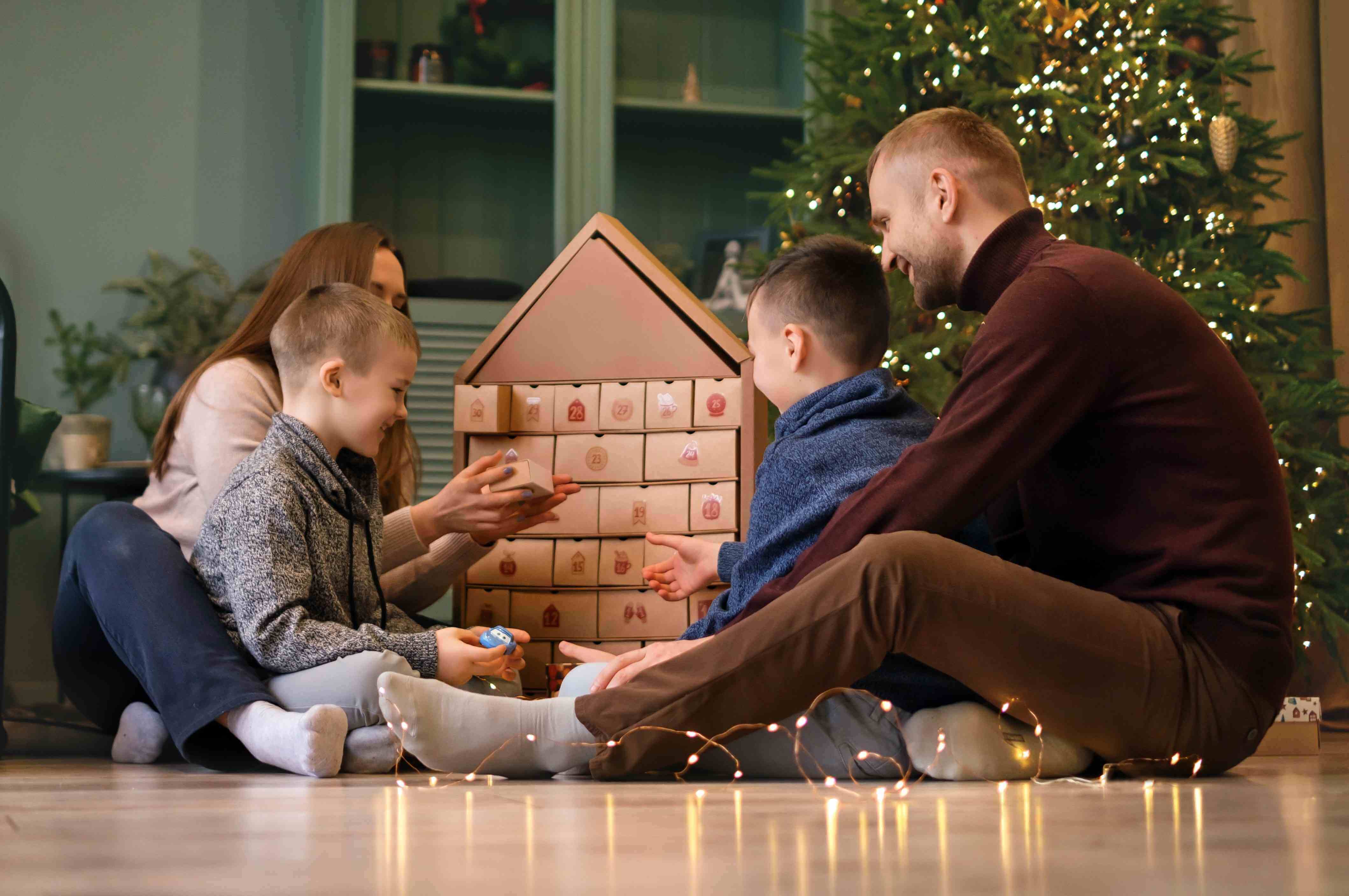 family opening an advent calendar